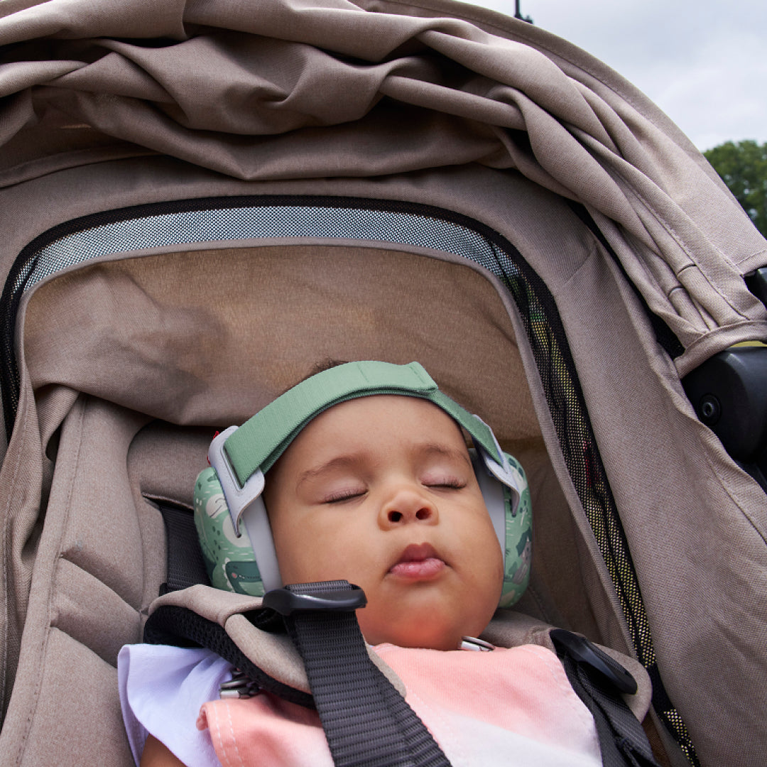 Baby sleeping while wearing muffy baby in happy-dinos
