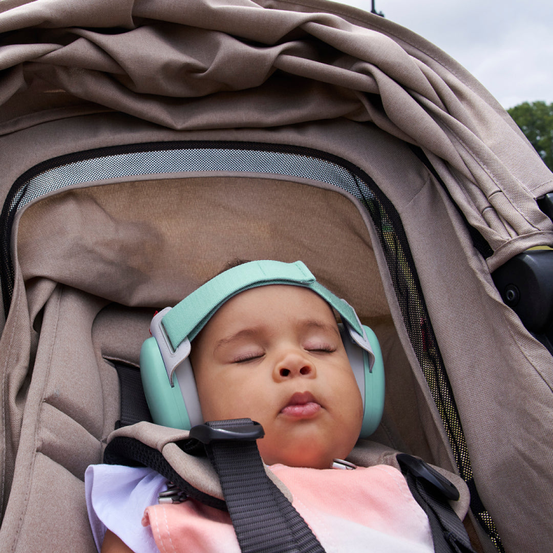 Baby sleeping while wearing muffy baby in fresh-aqua