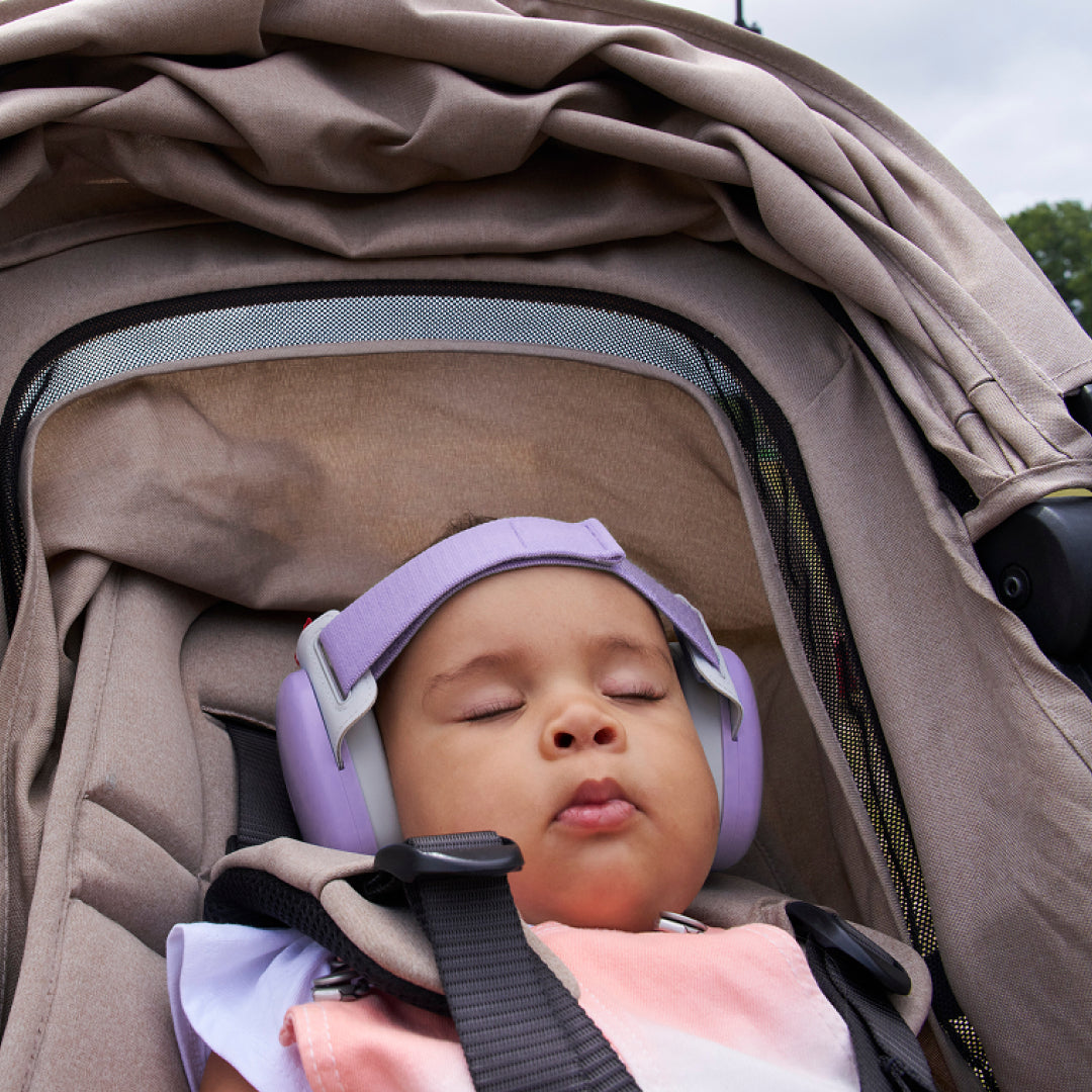 Baby sleeping while wearing muffy baby in dawn-purple