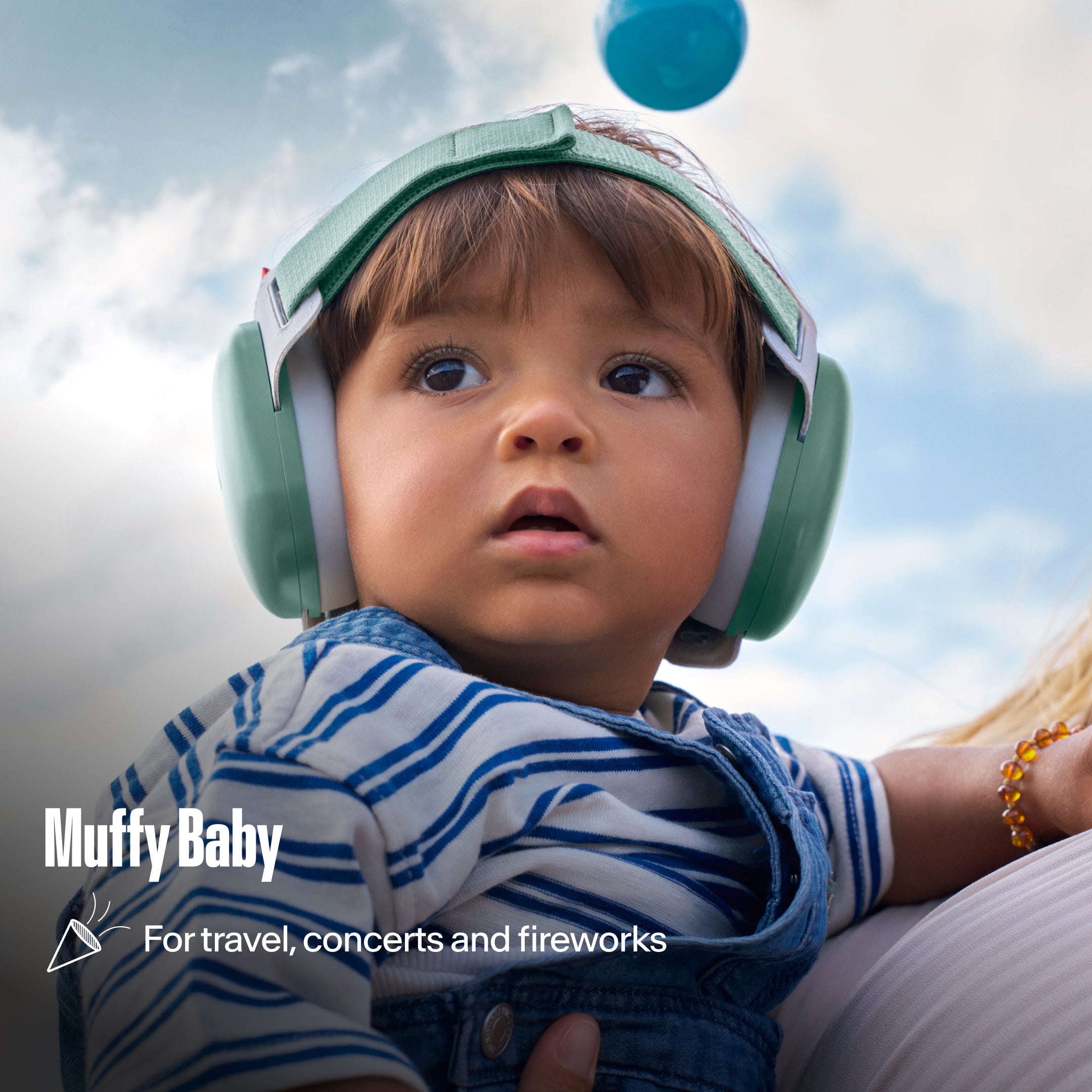 Alpine Muffy Baby earmuffs worn by a toddler outdoors, with the text &