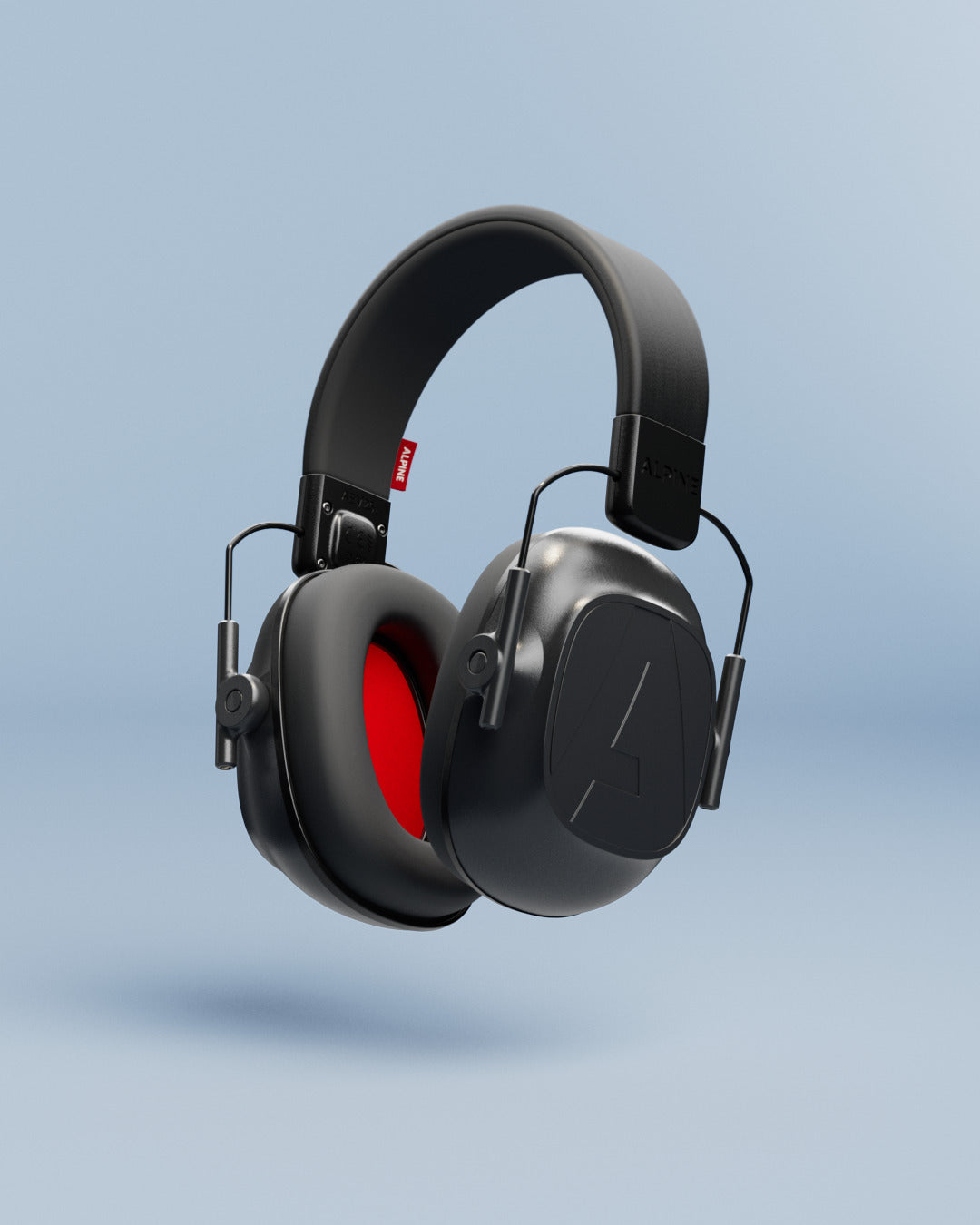 Alpine Defender earmuffs with red ear cushions, 3D render on a light blue background 
